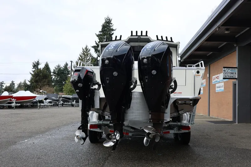 Slide: The Image of Rear view of 2026 Thunder Jet 26 Alexis Pro XL with triple outboard motors. - 6