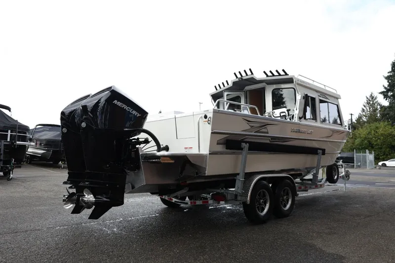 Slide: The Image of 2026 Thunder Jet 26 Alexis Pro XL boat on trailer with Mercury outboard engine. - 8