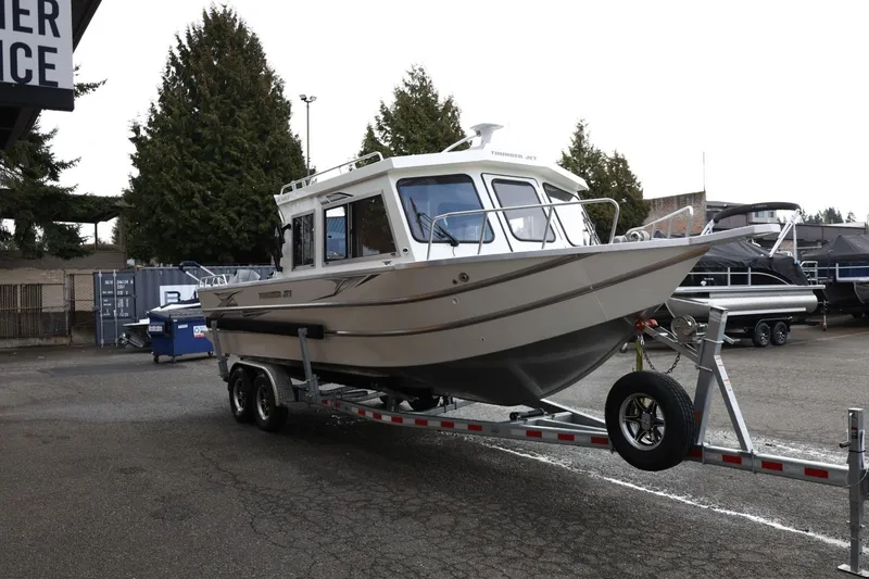 Slide: The Image of 2026 Thunder Jet 26 Alexis Pro XL boat on trailer in outdoor setting. - 9
