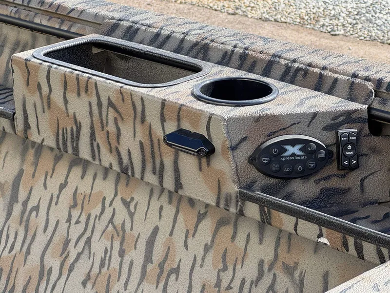 Slide: The Image of 2026 Xpress Hyper-Lift Duck Boat X18DB with camouflage pattern and control console. - 6
