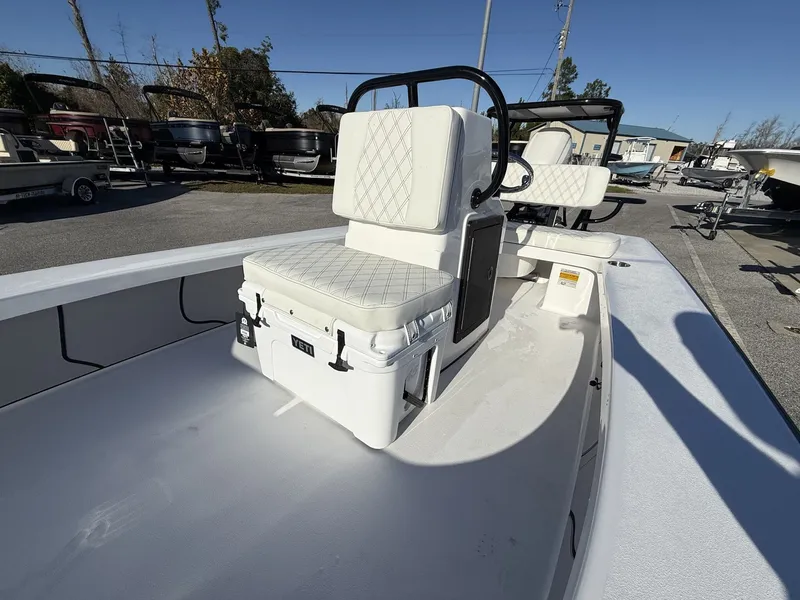 Slide: The Image of Xplor Delta 18CC GUIDE SERIES 2026 with white seat and Yeti cooler. - 11