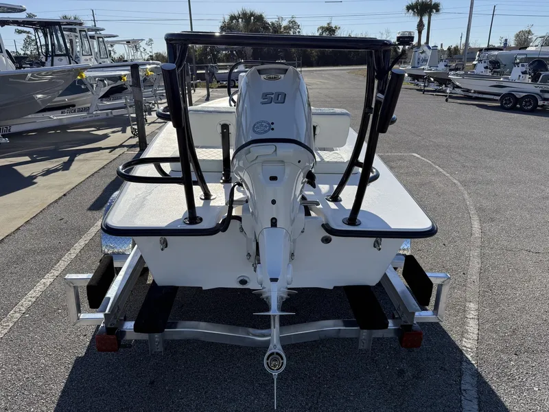 Slide: The Image of Xplor Delta 18CC GUIDE SERIES 2026 boat on trailer, rear view. - 4