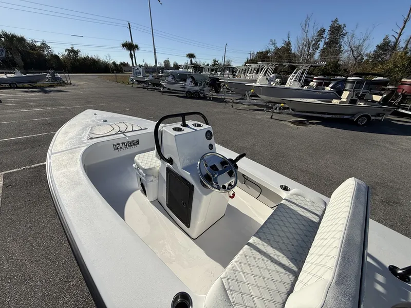 Slide: The Image of Xplor Delta 18CC GUIDE SERIES boat, 2026 model, parked outdoors. - 9