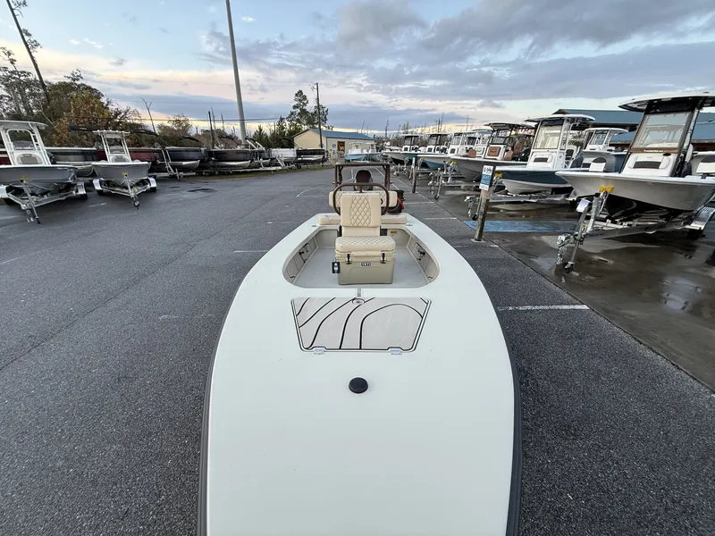 Slide: The Image of Xplor Delta 18CC GUIDE SERIES 2026 boat in parking lot at sunset. - 10