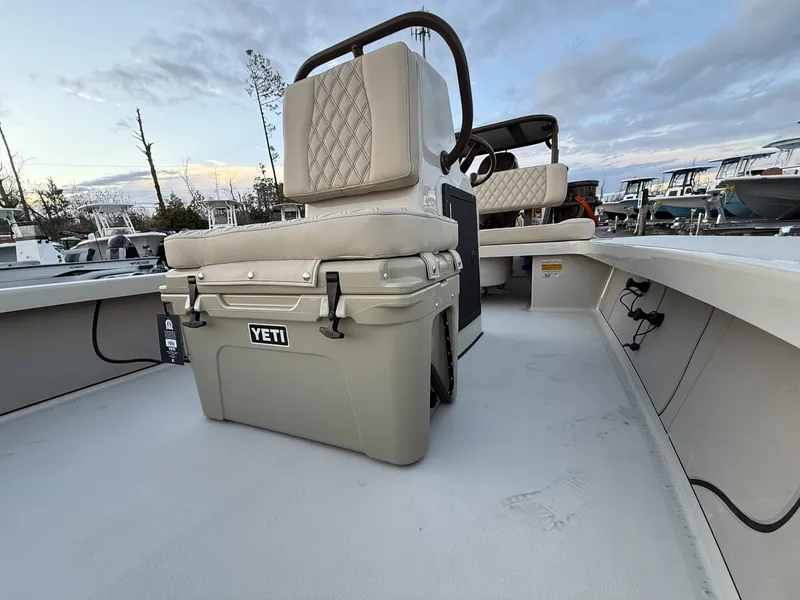 Slide: The Image of Xplor Delta 18CC GUIDE SERIES 2026 with Yeti cooler on deck. - 9
