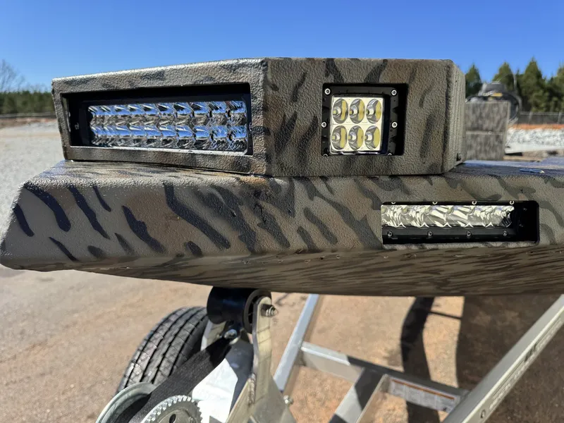 Slide: The Image of Xpress Bayou Series 180CC 2026 with LED lights and camouflage pattern. - 3