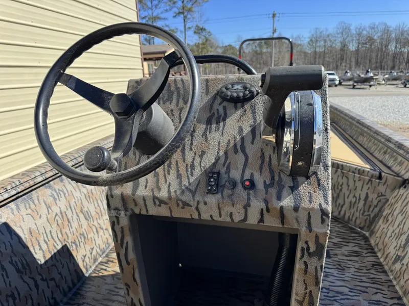 Slide: The Image of Steering console of Xpress Bayou Series 180CC boat, year 2026. - 5