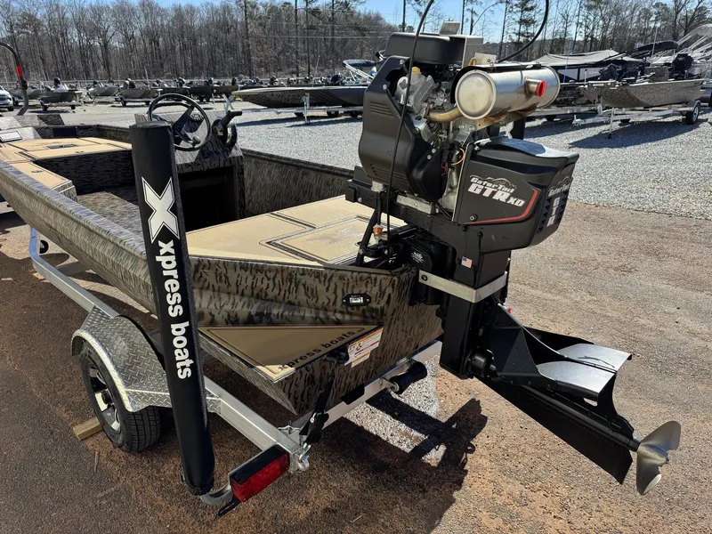 Slide: The Image of Xpress Bayou Series 180CC boat, 2026 model, with outboard motor. - 7