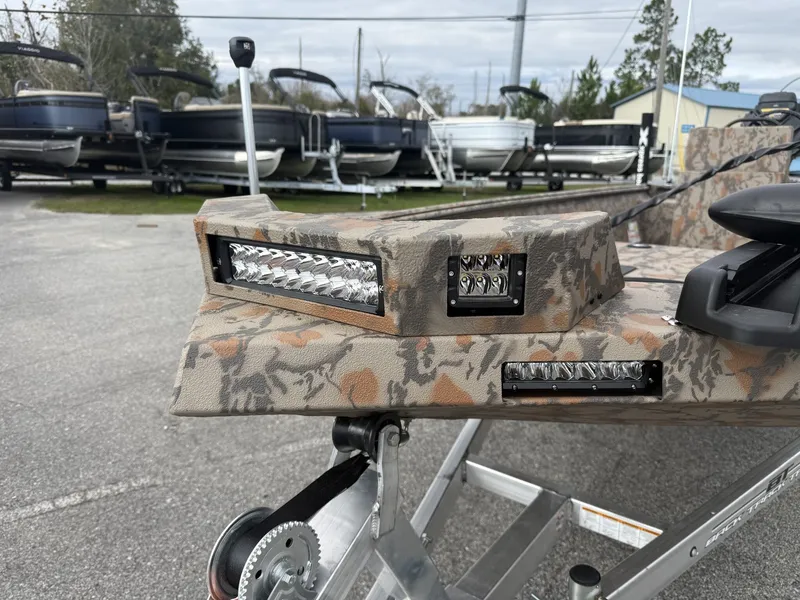 Slide: The Image of Xpress Bayou Series 180CC 2026 with camouflage pattern and LED lights. - 5