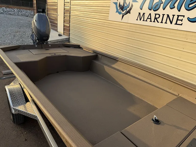 Slide: The Image of 2026 Xpress HD16DBX boat with outboard motor, side view. - 5