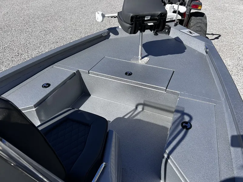 Slide: The Image of 2026 Xpress H20B Bay boat with gray deck and seat. - 2