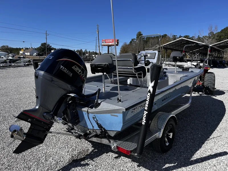 Slide: The Image of 2026 Xpress H20B Bay boat with Yamaha engine on trailer. - 4