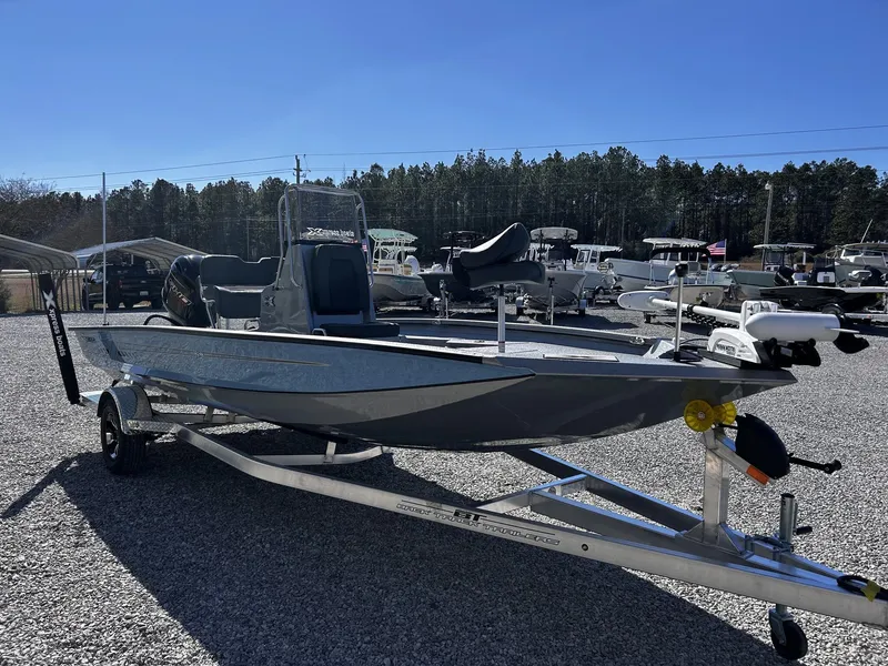 Slide: The Image of 2026 Xpress H20B Bay boat on trailer outdoors. - 5
