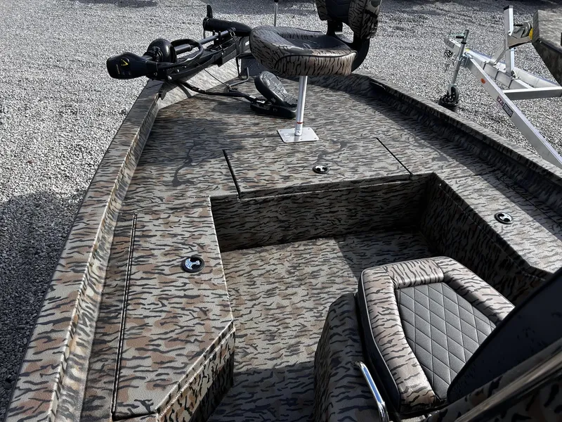 Slide: The Image of 2026 Xpress H20B Bay boat with camouflage pattern and seating. - 10