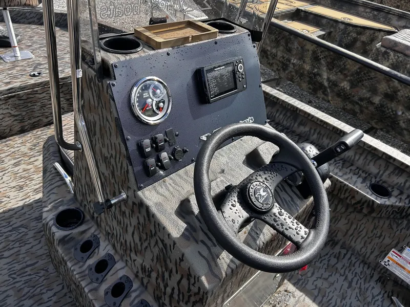 Slide: The Image of Steering console of Xpress H20B Bay boat, model year 2026. - 11