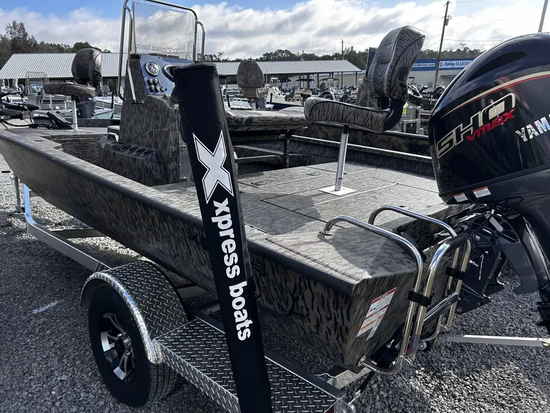 Slide: The Image of 2026 Xpress H20B Bay boat with Yamaha motor on trailer. - 4