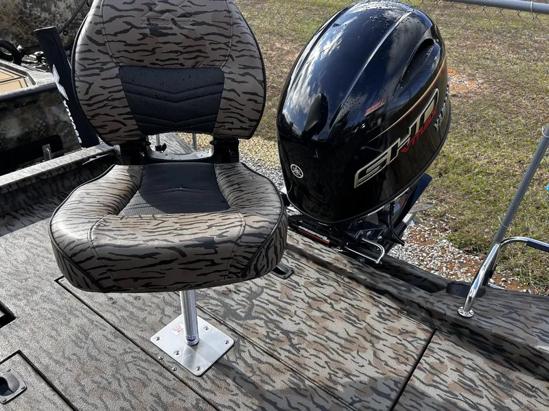 Slide: The Image of 2026 Xpress H20B Bay boat with Yamaha engine and camouflage seat. - 5