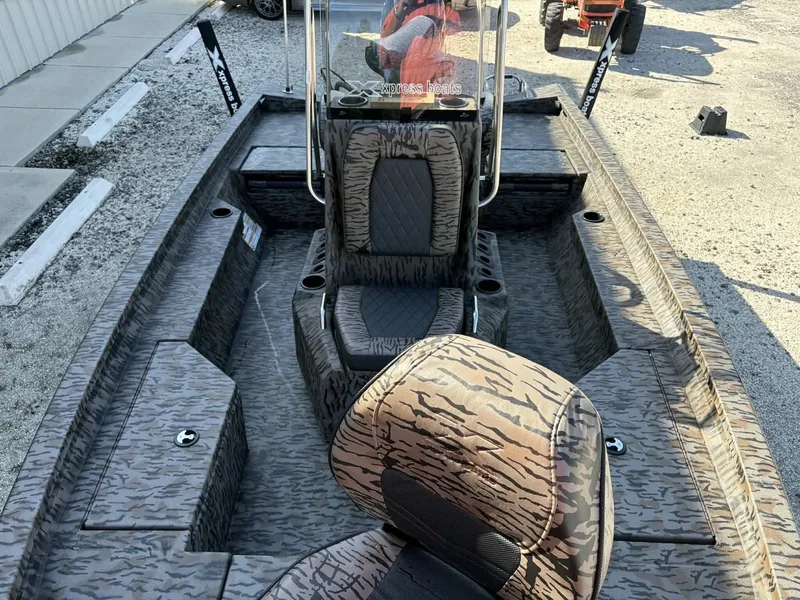 Slide: The Image of 2026 Xpress H20B Bay boat with camouflage pattern design. - 10
