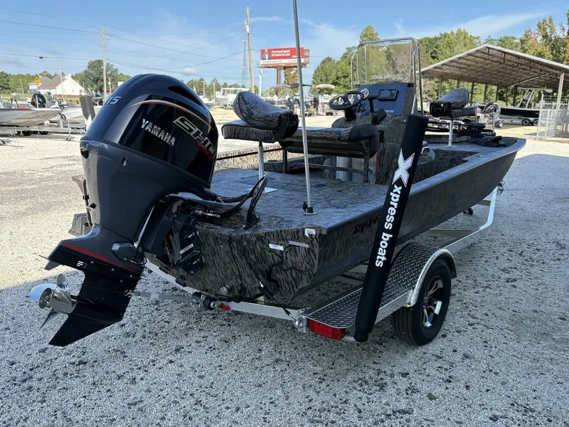 Slide: The Image of 2026 Xpress H20B Bay boat with Yamaha engine on trailer. - 6