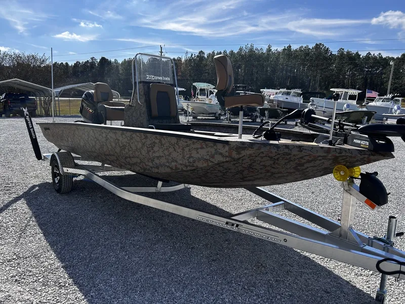 Slide: The Image of 2026 Xpress H20B Bay boat on trailer outdoors. - 3