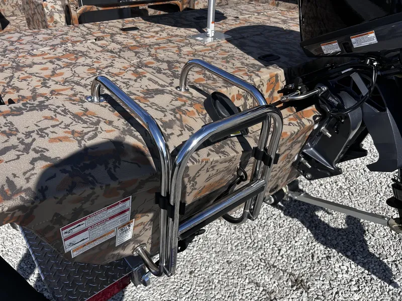 Slide: The Image of 2026 Xpress H20B Bay boat with camouflage pattern and stainless steel ladder. - 5
