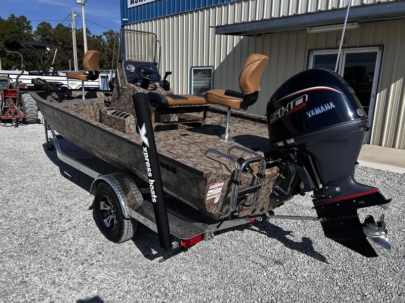 Slide: The Image of 2026 Xpress H20B Bay boat with Yamaha engine on trailer. - 6