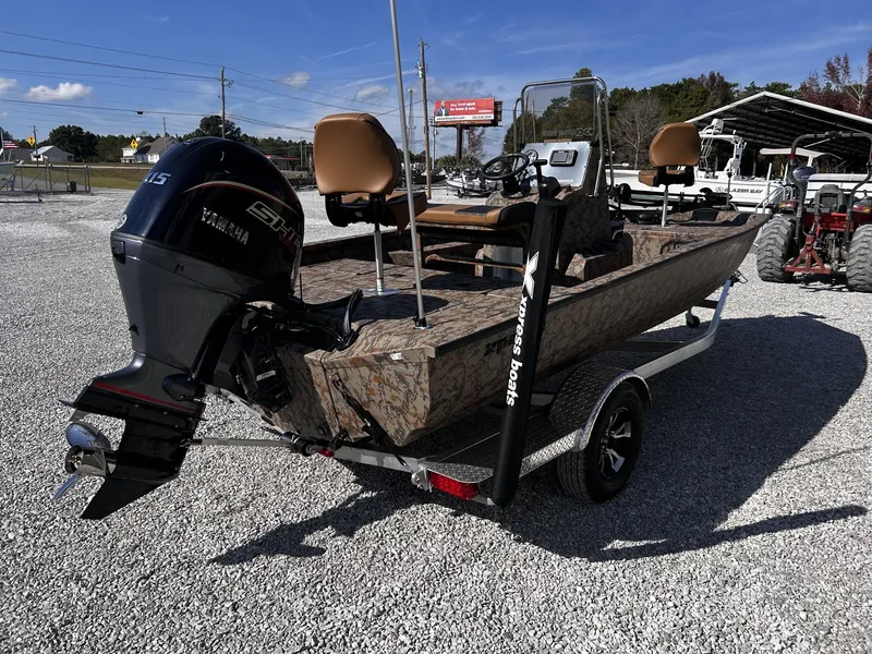 Slide: The Image of 2026 Xpress H20B Bay boat with Yamaha engine on trailer. - 7