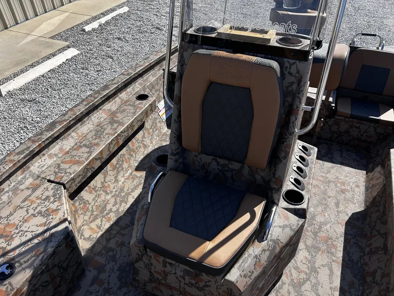 Slide: The Image of 2026 Xpress H20B Bay boat with camouflage pattern and comfortable seating. - 9