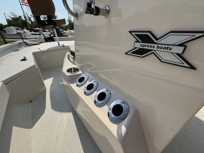 Slide: The Image of Xpress H20B Bay 2026 boat with rod holders and logo. - 10