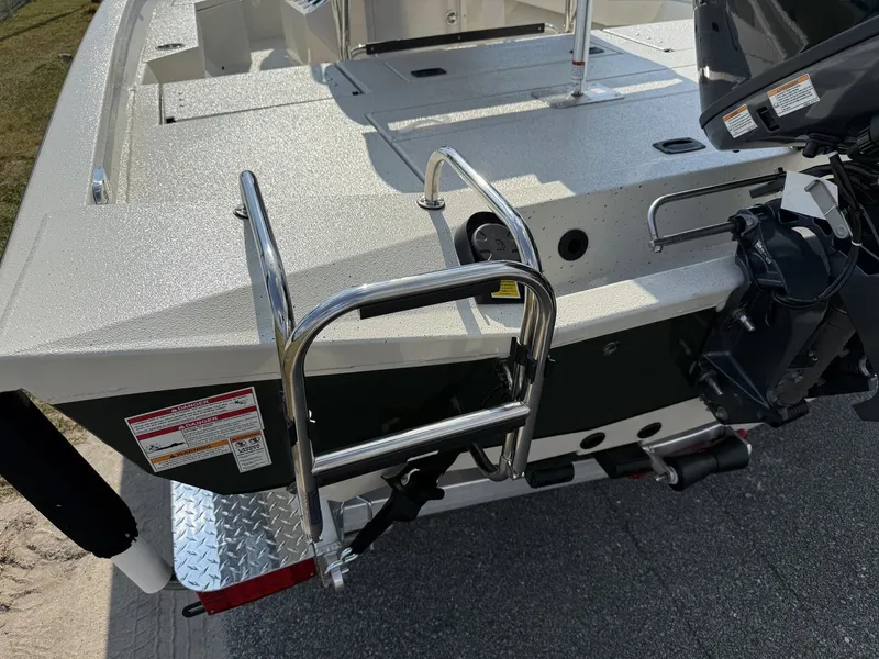 Slide: The Image of 2026 Xpress H20B Bay boat with ladder and motor. - 5