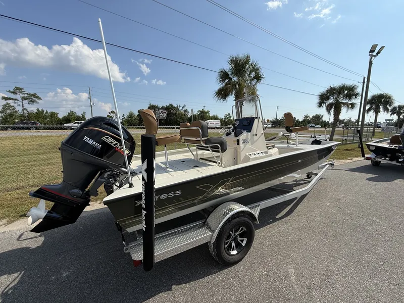 Slide: The Image of 2026 Xpress H20B Bay boat with Yamaha engine on trailer. - 7