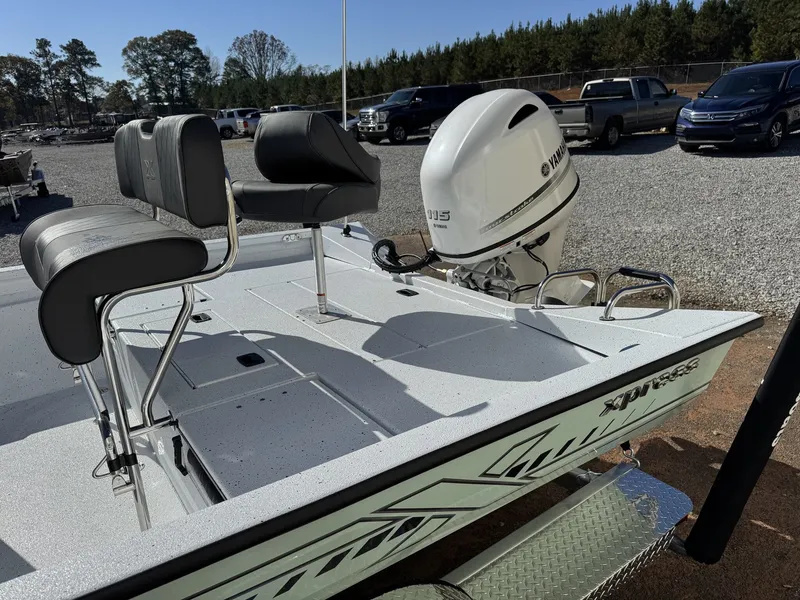 Slide: The Image of 2026 Xpress H20B Bay boat with Yamaha engine in parking lot. - 9