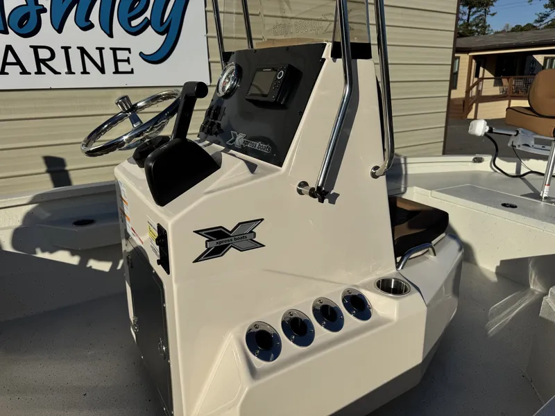 Slide: The Image of 2026 Xpress H20B Bay boat console at a marina. - 6