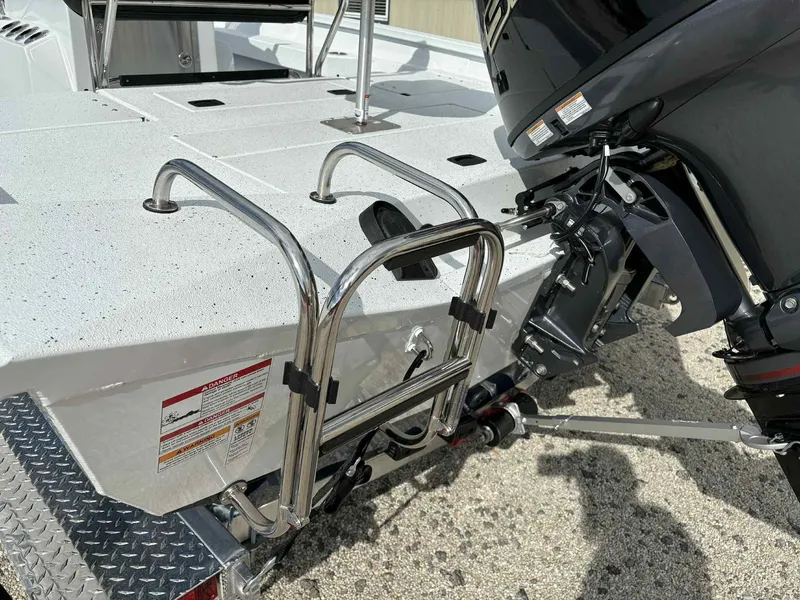 Slide: The Image of 2026 Xpress H20B Bay boat with motor and ladder. - 16