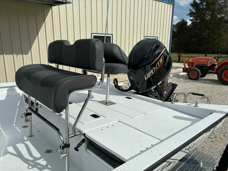 Slide: The Image of 2026 Xpress H20B Bay boat with motor and seating. - 17