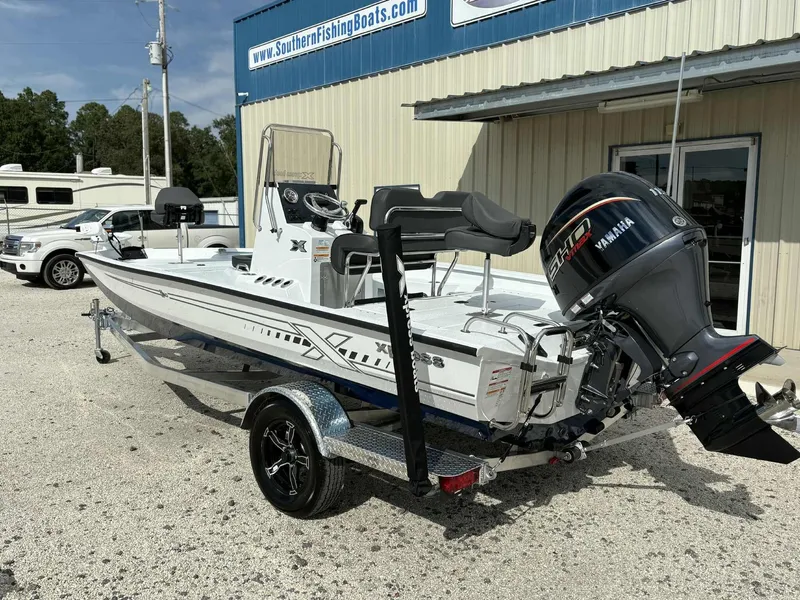 Slide: The Image of 2026 Xpress H20B Bay boat with Yamaha engine on trailer. - 2