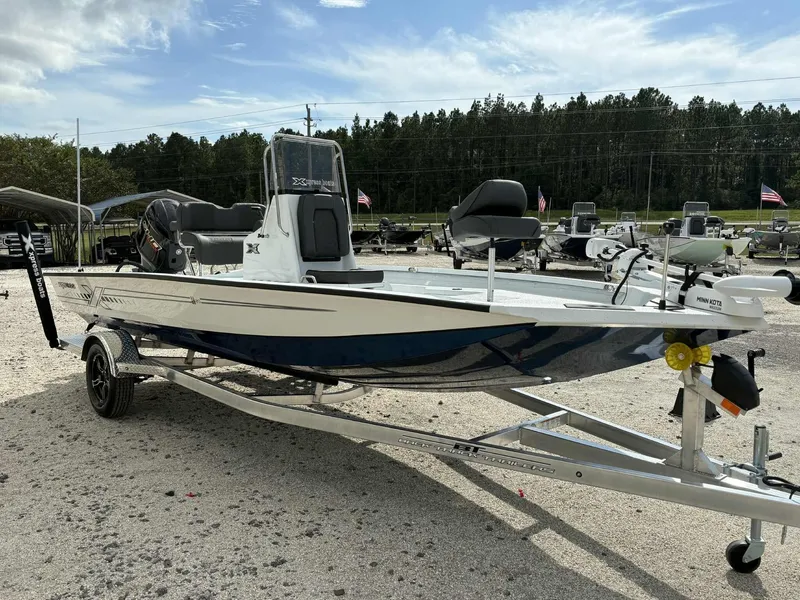 Slide: The Image of 2026 Xpress H20B Bay boat on trailer outdoors. - 4