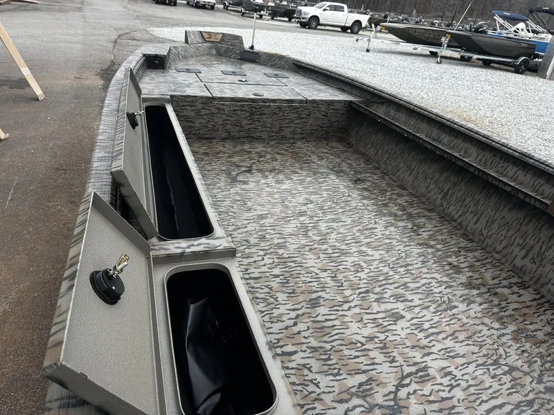 Slide: The Image of 2026 Xpress Hyper-Lift Duck Boat X18DB with camouflage pattern and storage compartments. - 4