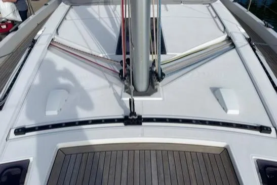 Slide: The Image of 2022 Beneteau Oceanis Yacht 54 deck with mast and rigging details. - 10