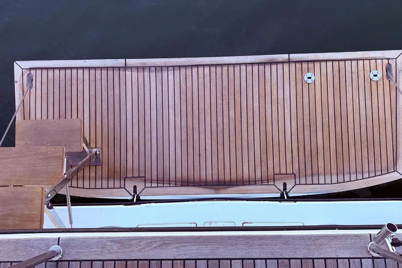 Slide: The Image of Beneteau Oceanis Yacht 54, 2022, teak deck view, elegant marine craftsmanship. - 16