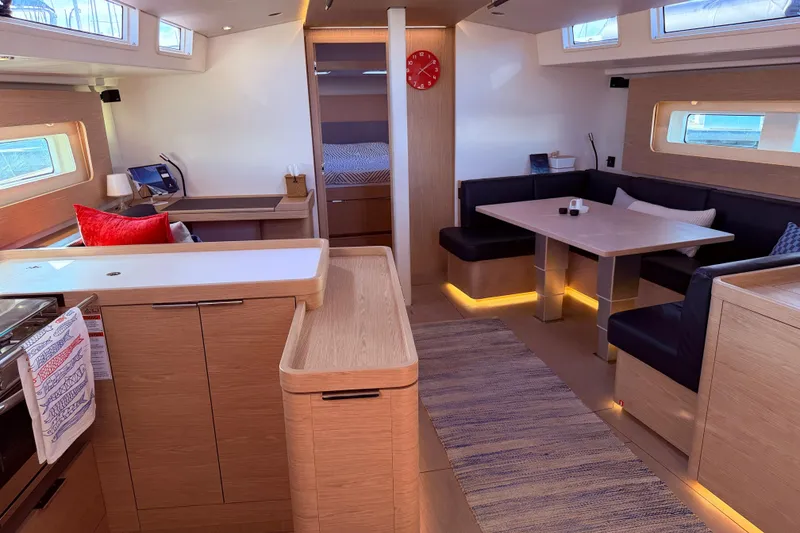 Slide: The Image of Luxurious interior of 2022 Beneteau Oceanis Yacht 54 with modern dining and seating area. - 30