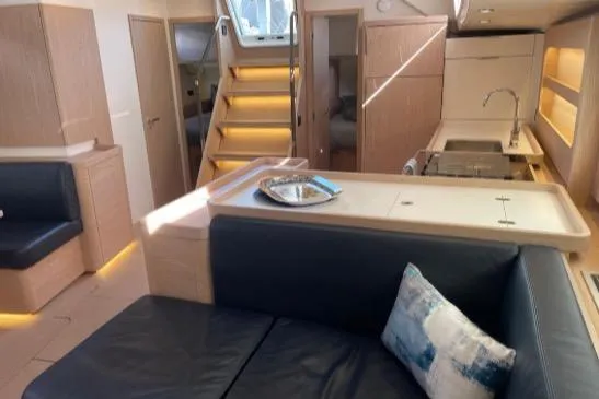 Slide: The Image of Interior of 2022 Beneteau Oceanis Yacht 54, featuring modern design and comfortable seating. - 31