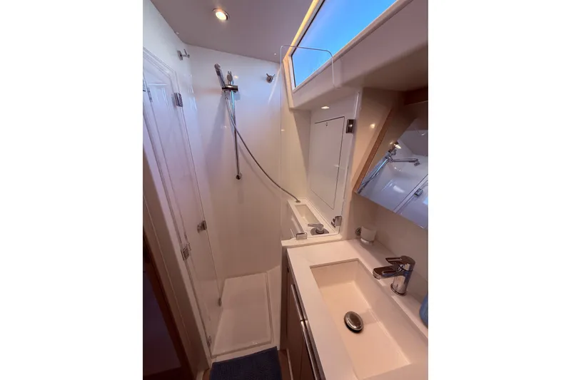 Slide: The Image of Luxurious bathroom in 2022 Beneteau Oceanis Yacht 54 with modern fixtures and shower. - 42