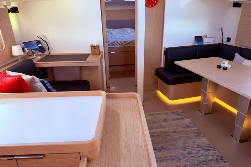 Slide: The Image of Luxurious interior of 2022 Beneteau Oceanis Yacht 54 with modern furnishings and ambient lighting. - 45