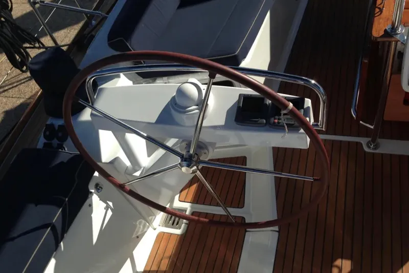 Slide: The Image of Steering wheel of a 2011 Jeanneau 57 yacht with wooden deck. - 20
