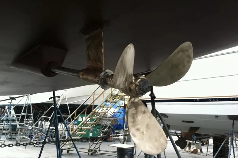 Slide: The Image of Propeller of 2011 Jeanneau 57 yacht in dry dock, showing maintenance setup. - 23