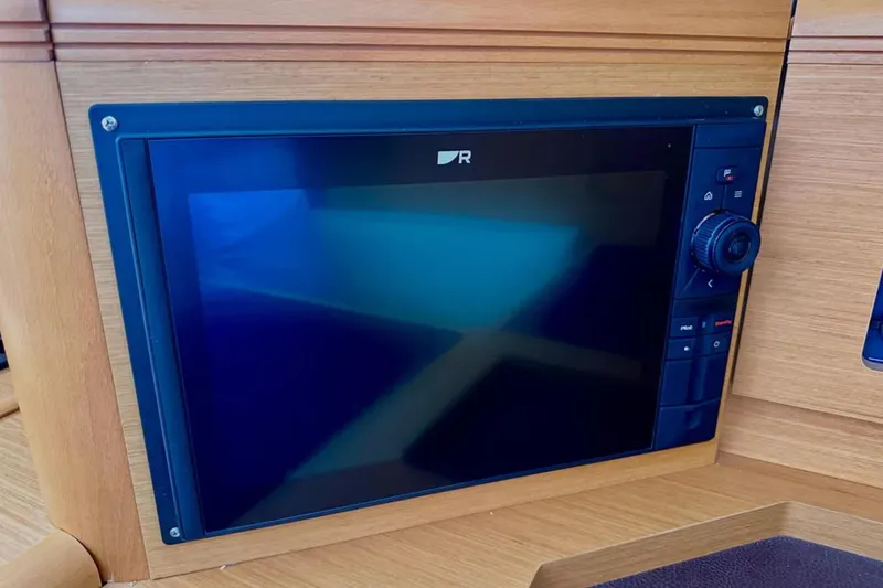 Slide: The Image of Navigation display on a 2011 Jeanneau 57 yacht, featuring a sleek control panel. - 28