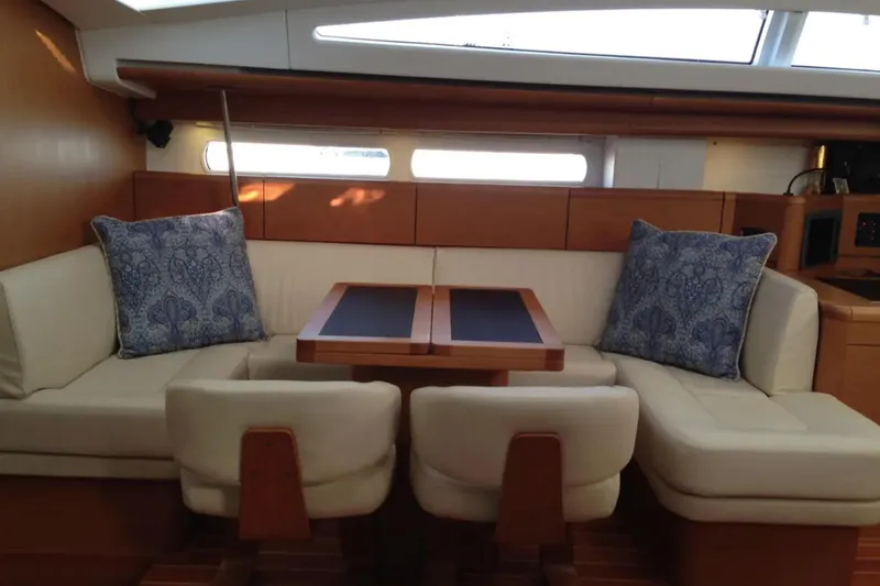 Slide: The Image of Luxurious interior of 2011 Jeanneau 57 yacht with elegant seating and cushions. - 37