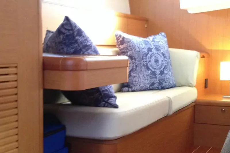Slide: The Image of Interior of 2011 Jeanneau 57 yacht with cozy seating and decorative pillows. - 47