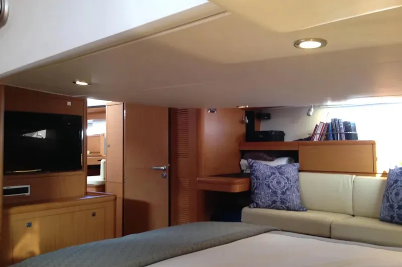 Slide: The Image of Luxurious interior of 2011 Jeanneau 57 yacht with cozy seating and modern amenities. - 49